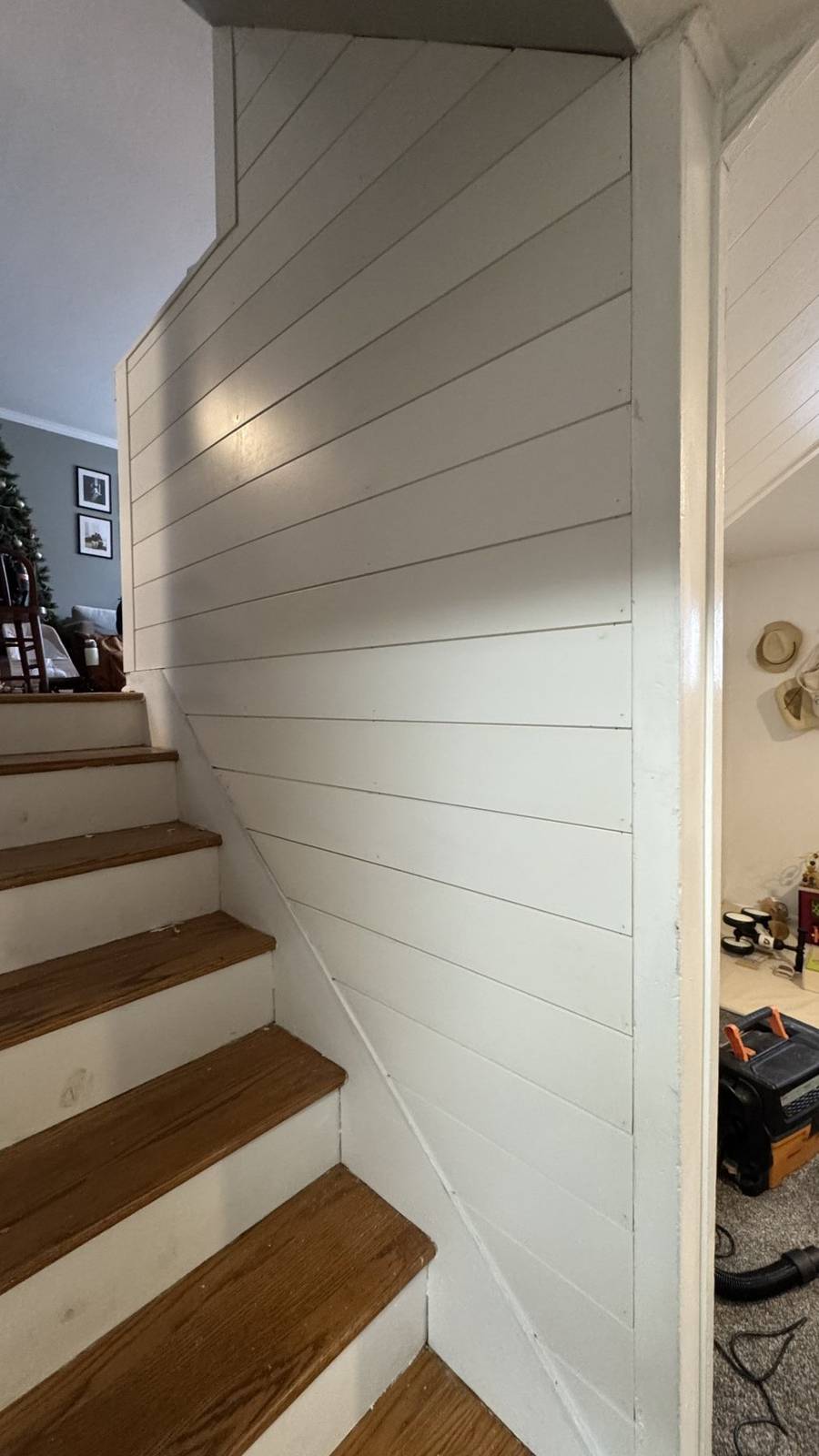 Close view of fitted white shiplap along a staircase